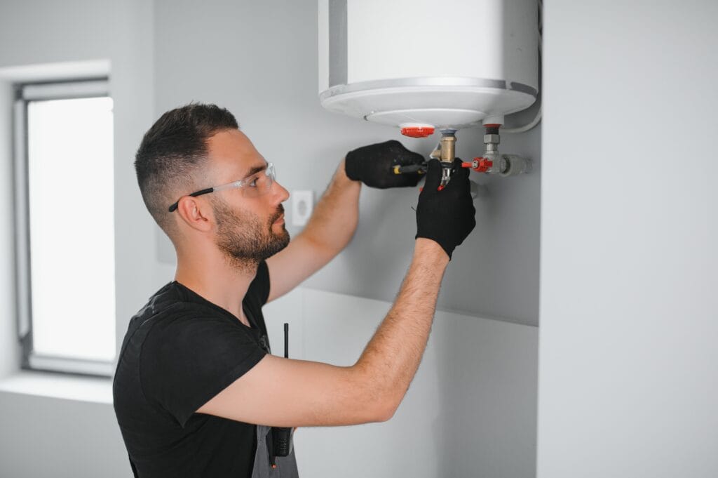 Technician performing water heater maintenance in Lutz