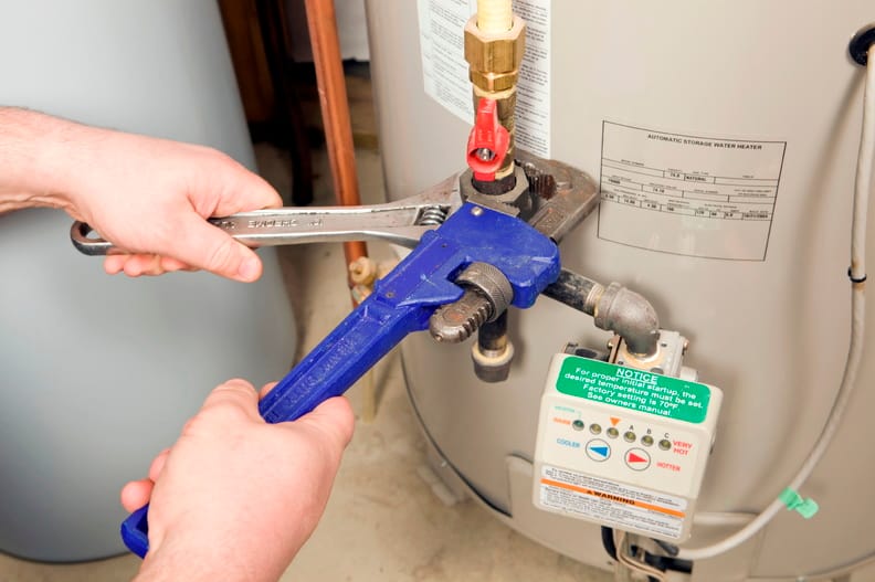 Plumber repairing a water heater valve in Lutz